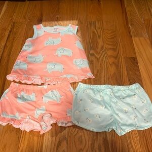 Three piece kids pajama set with elephants and flowers.